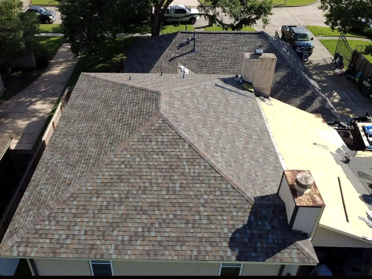 Aerial view of a roof being replaced on a house