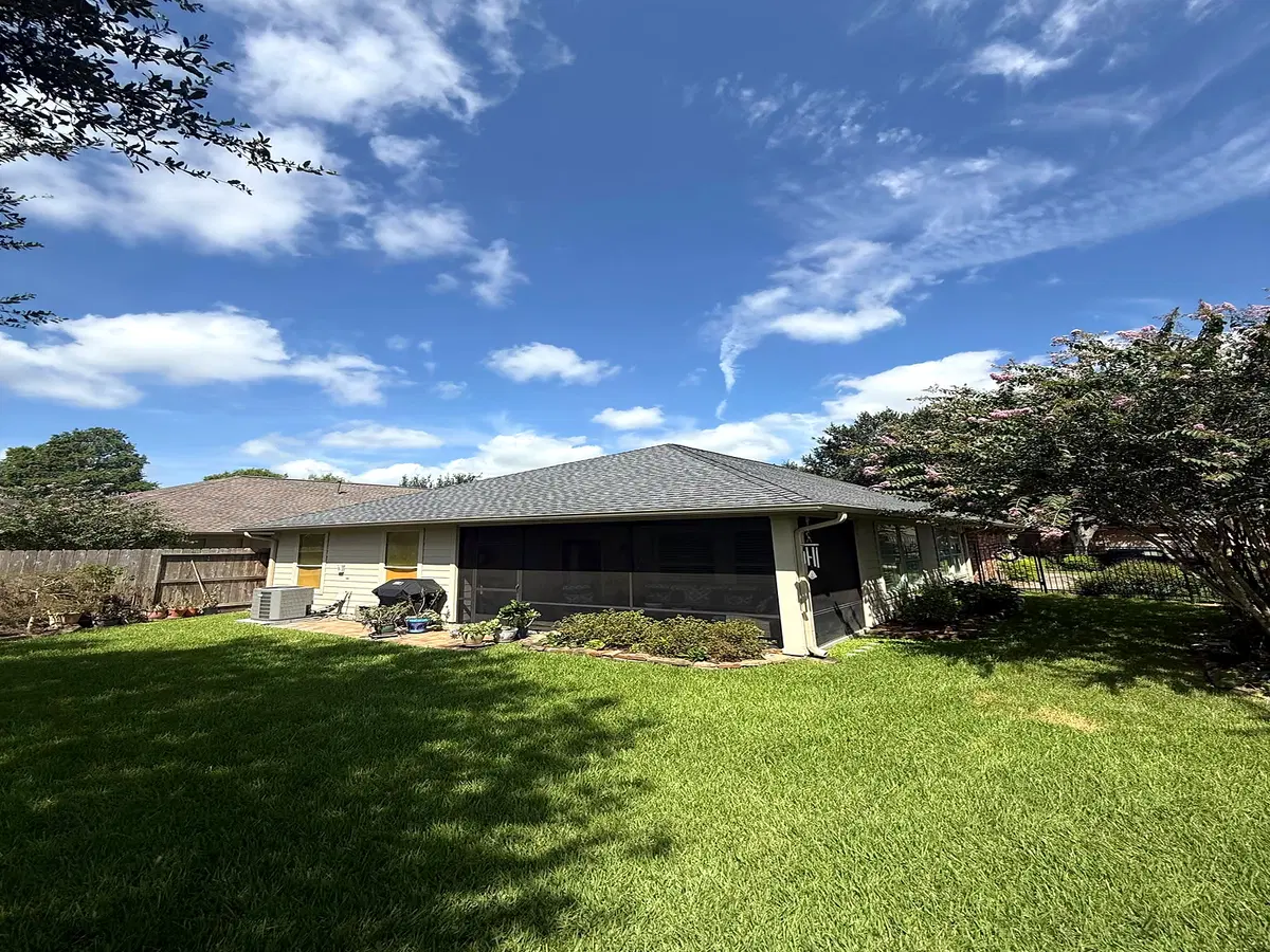 Completed shingle roof over a backyard living area