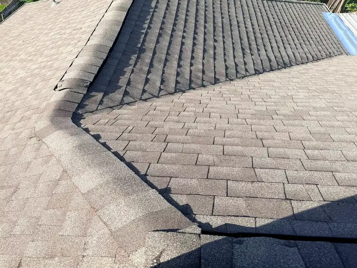 Detailed view of shingle courses and ridges on a residential roof